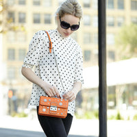 The Hollywood Studded Leather Crossbody Bag Orange.