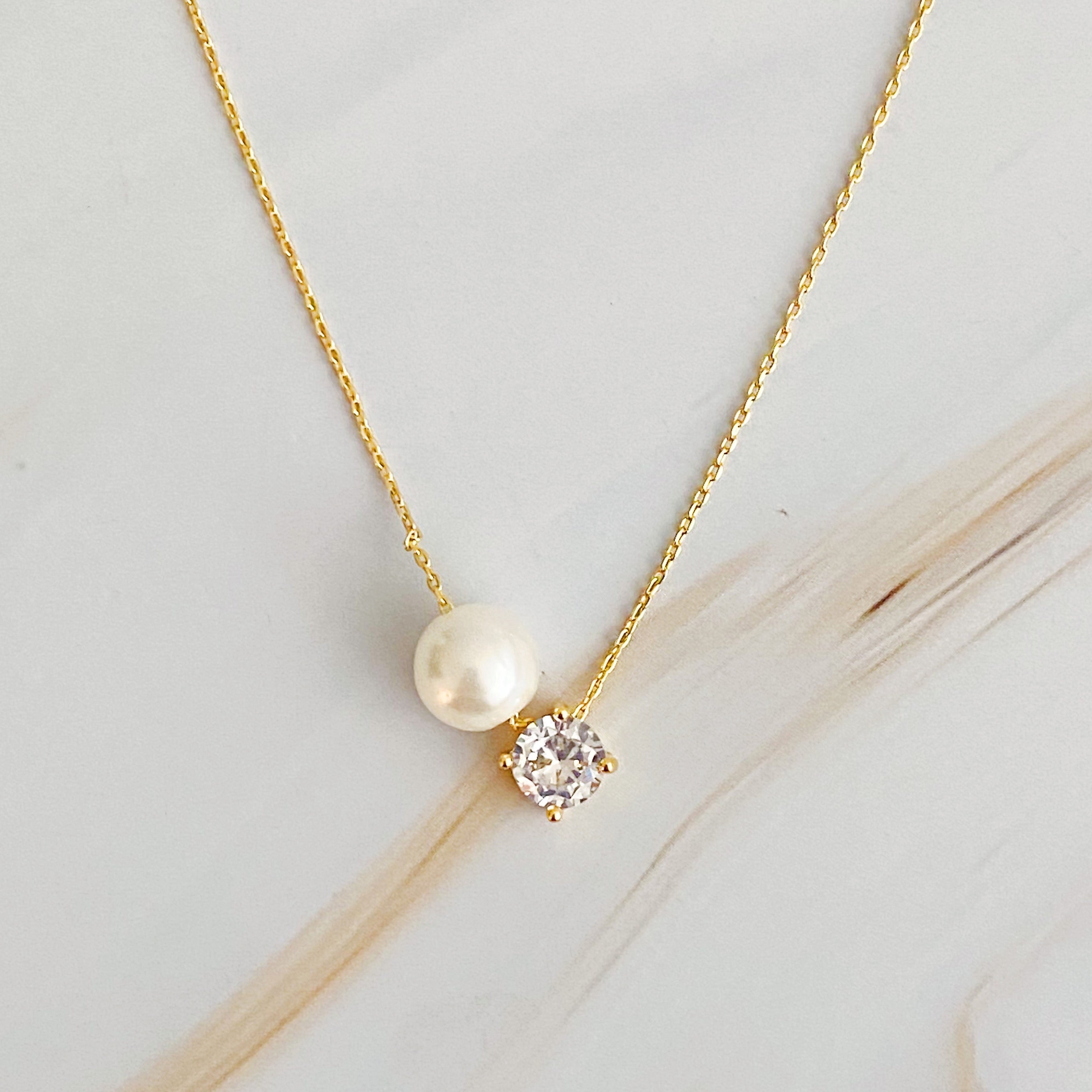 Single Pearl and Diamond Necklace.