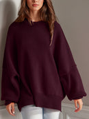 Double Take Side Slit Round Neck Long Sleeve Sweater.