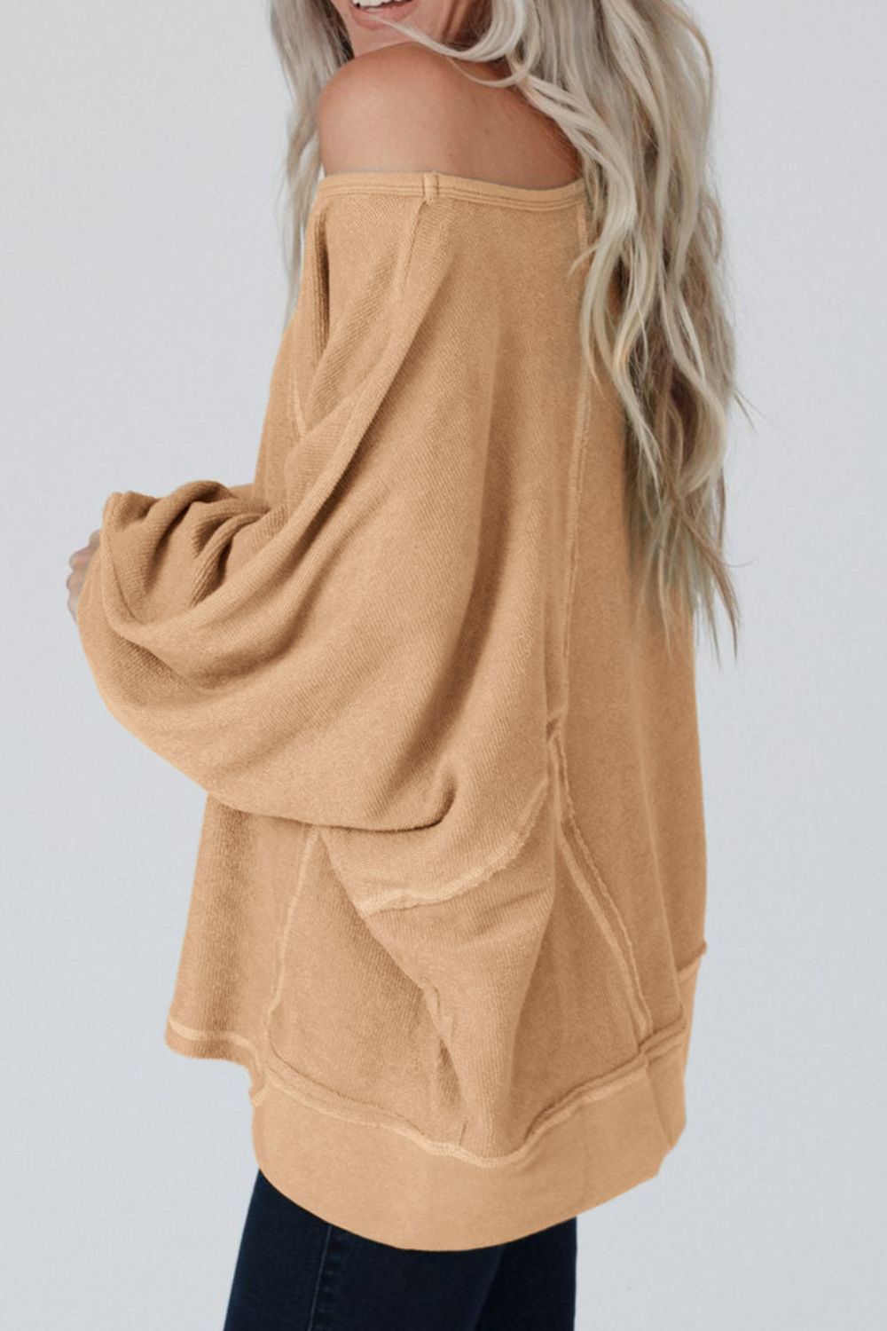 Exposed Seam Single Shoulder Long Sleeve Top.