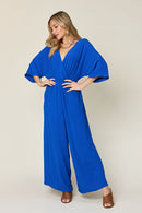 Double Take Full Size Surplice Wide Leg Jumpsuit with Pockets.