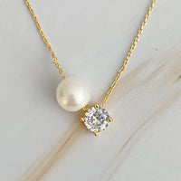 Single Pearl and Diamond Necklace.