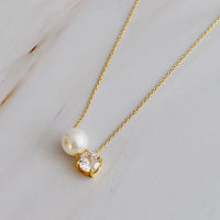 Single Pearl and Diamond Necklace.