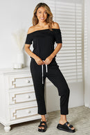 Double Take Asymmetrical Neck Tied Jumpsuit with Pockets.