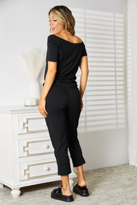 Double Take Asymmetrical Neck Tied Jumpsuit with Pockets.