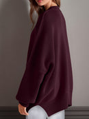 Double Take Side Slit Round Neck Long Sleeve Sweater.