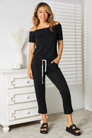 Double Take Asymmetrical Neck Tied Jumpsuit with Pockets.