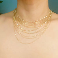 Beautifully Draping Pearl and Chain Necklace.