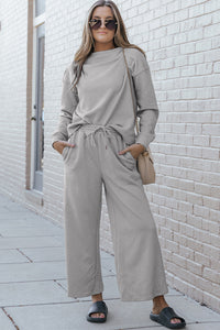 Double Take Full Size Textured Long Sleeve Top and Drawstring Pants Set.