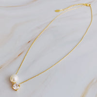 Single Pearl and Diamond Necklace.